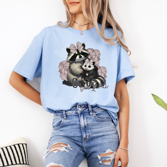 Cute but feral raccoon and possum